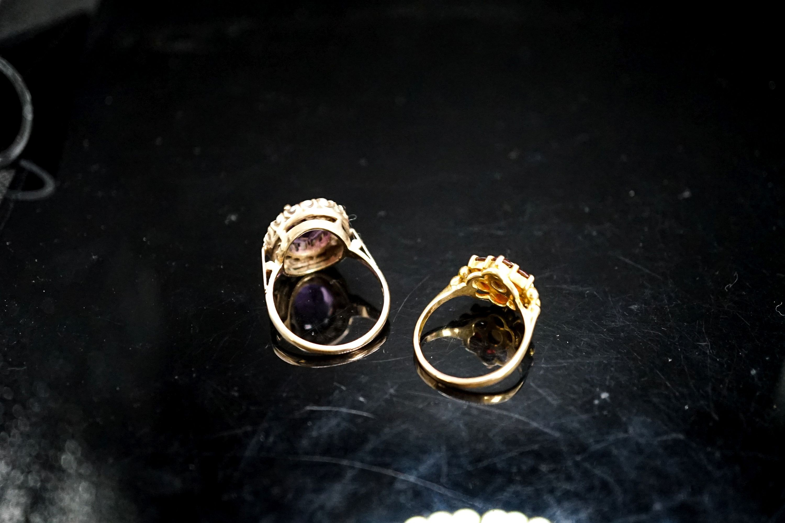 A 9ct garnet and cultured pearl ring and a 9ct gold amethyst and seed pearl mounted ring, gross 9.4 grams.